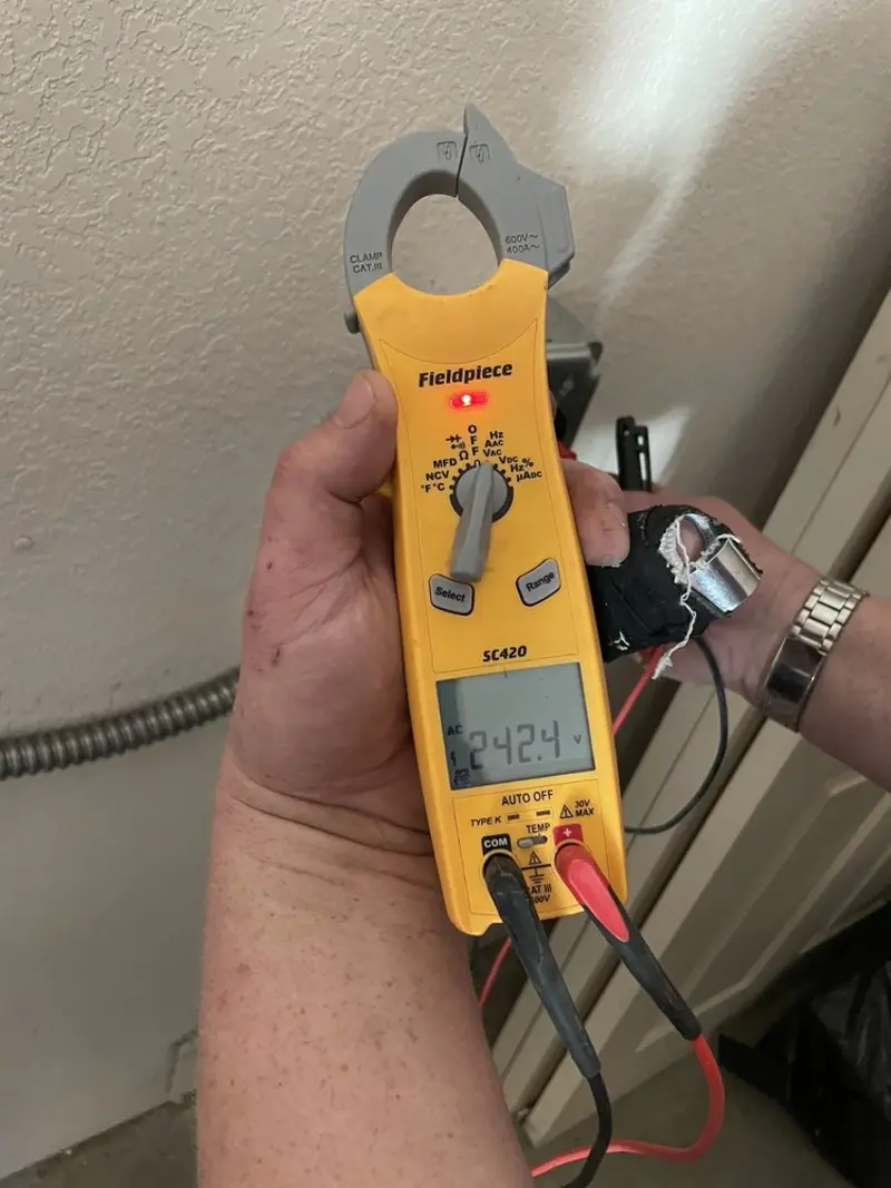 Voltage testing with clamp meter during Whole House Surge Protector in Ballinger